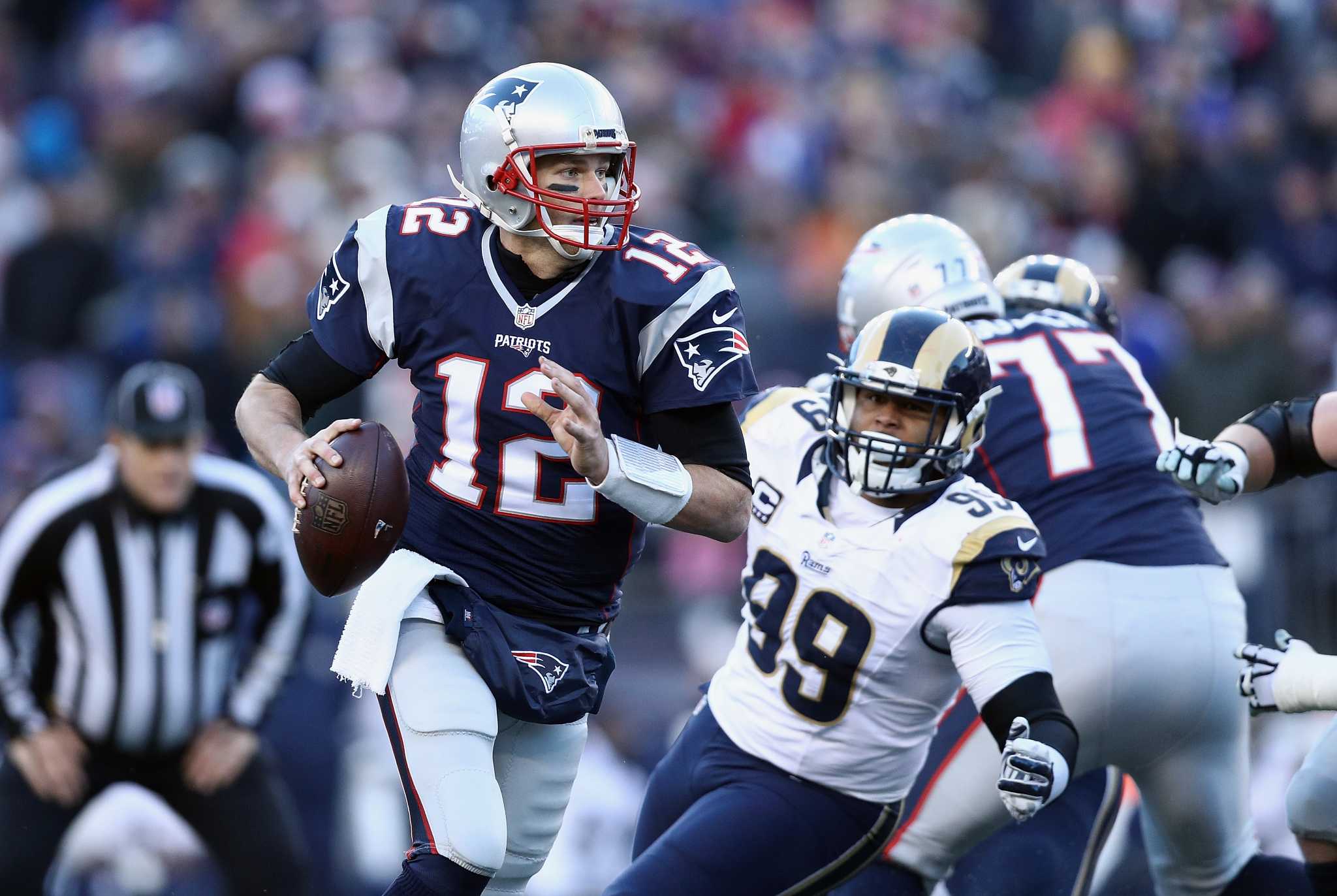 Brady breaks QB wins record, Patriots beat Rams 26-10