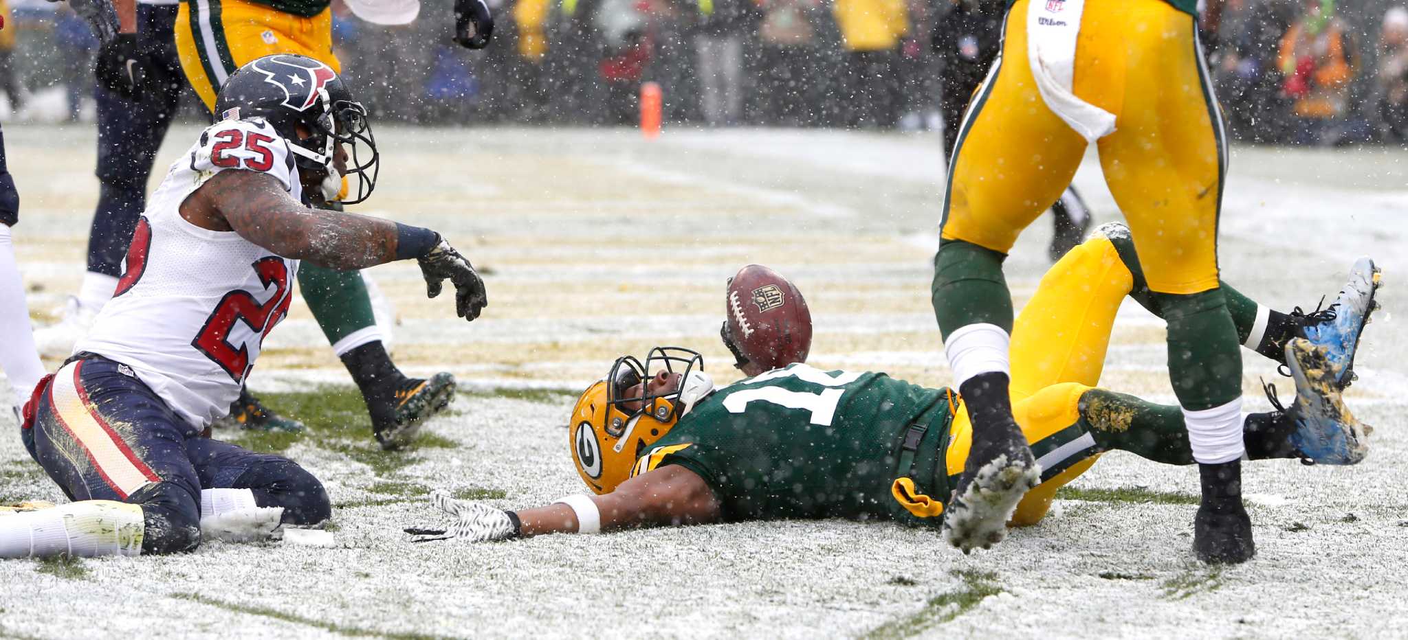 Green Bay Packers' Randall Cobb makes snow angel in end zone
