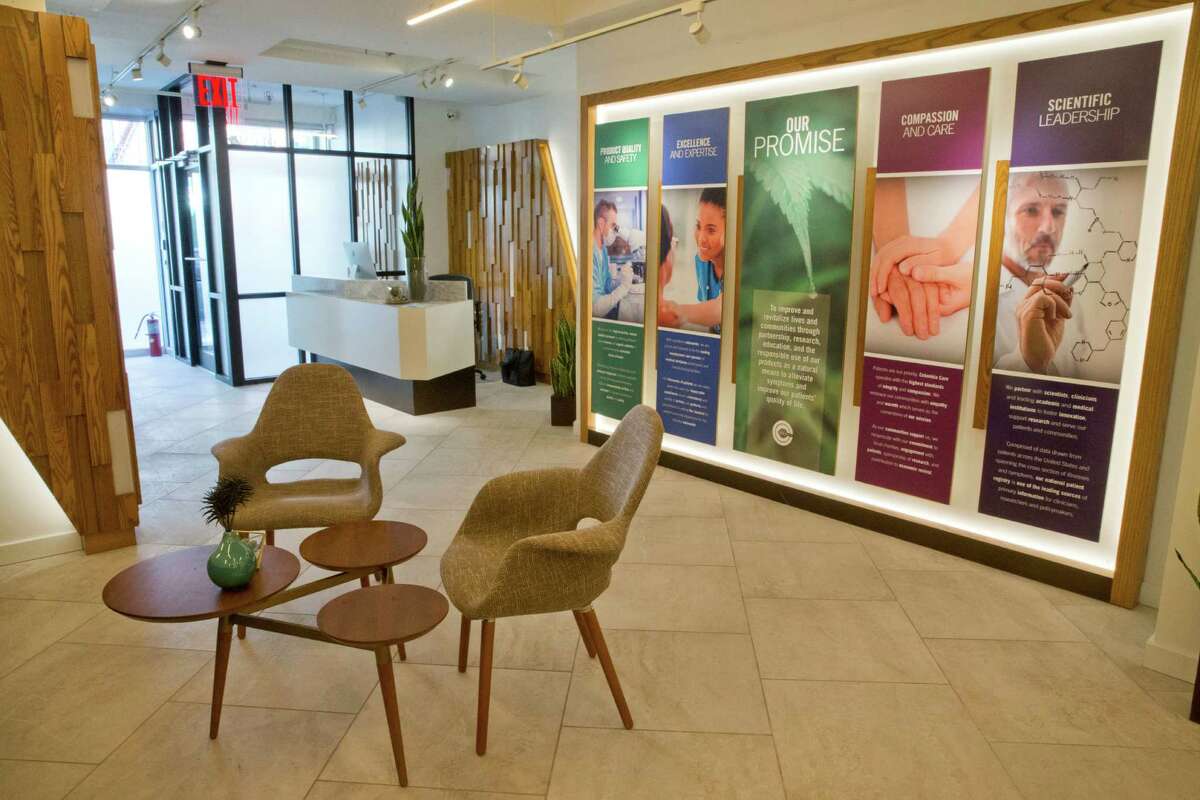 This Jan. 6, 2016, file photo, shows the reception area of a Columbia Care medical cannabis dispensary in New York. The company, which will now be acquired by Cresco Labs, was one of the original five medical cannabis companies licensed in New York. (AP Photo/Mary Altaffer, File) 
