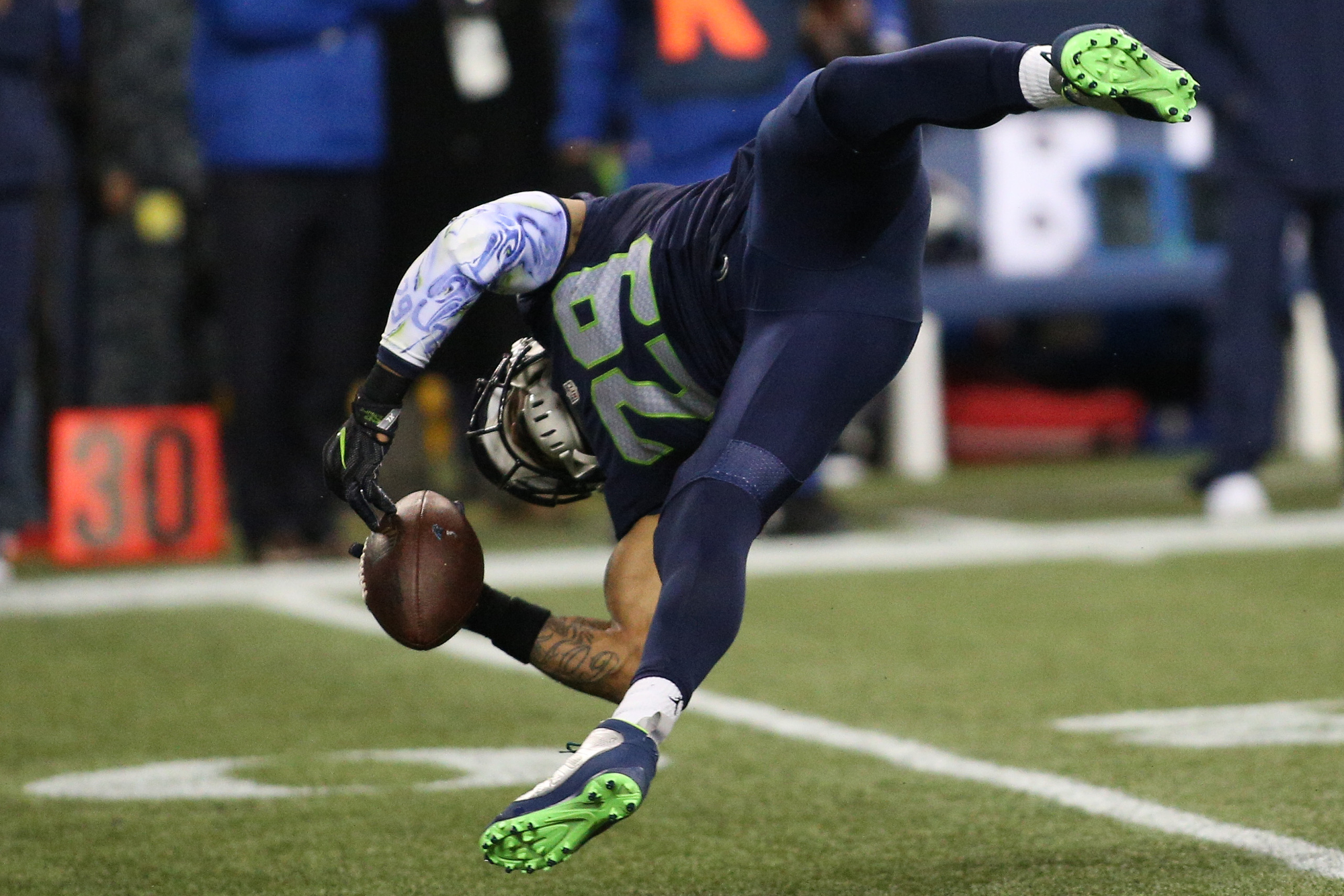 Seattle Seahawks strong safety Kam Chancellor (31) collides with Seattle  Seahawks free safety Earl Thomas (29) during a near interception while  covering Carolina Panthers tight end Greg Olsen (88) at CenturyLink Field