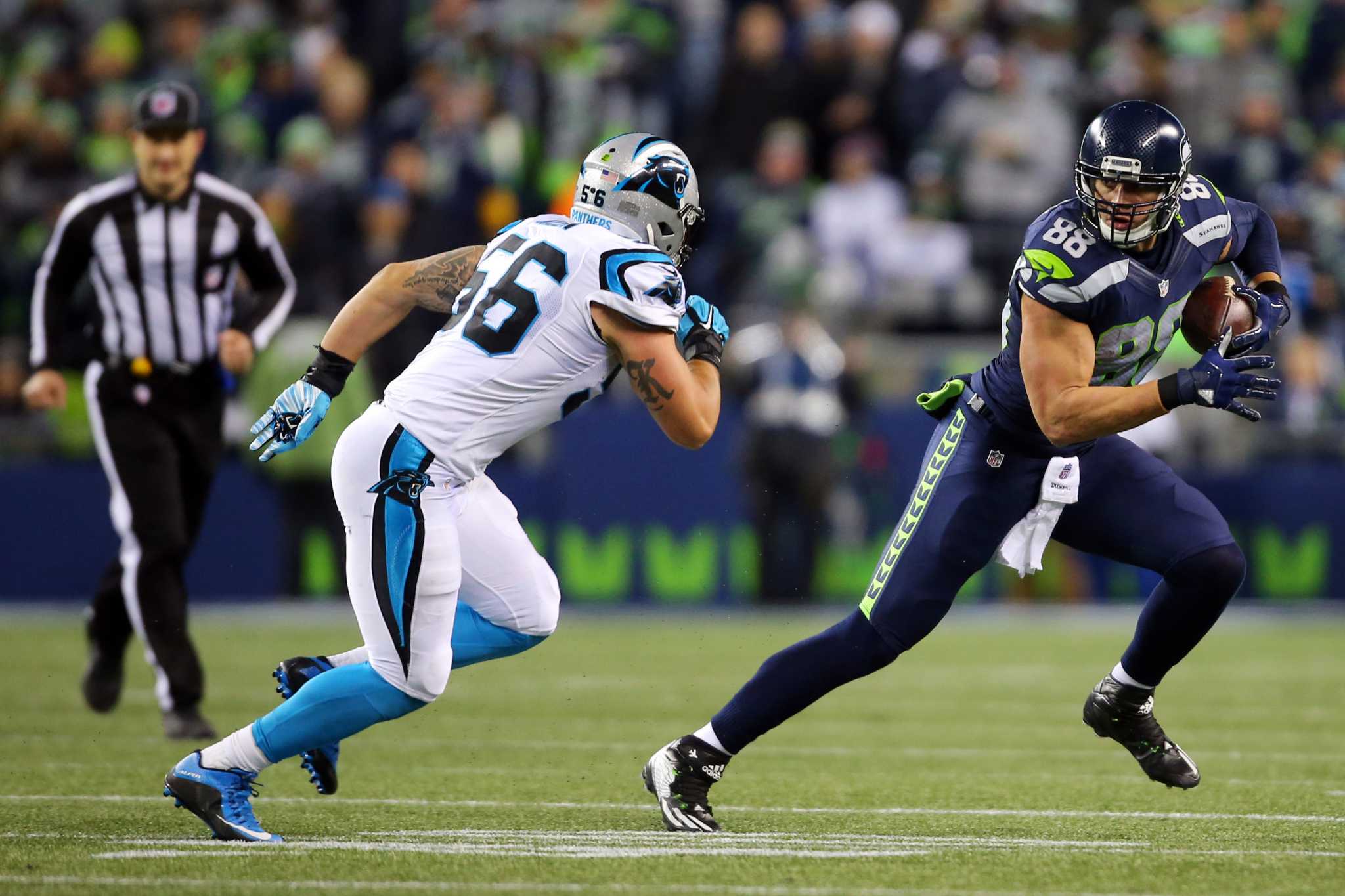 Seattle Seahawks strong safety Kam Chancellor (31) collides with Seattle  Seahawks free safety Earl Thomas (29) during a near interception while  covering Carolina Panthers tight end Greg Olsen (88) at CenturyLink Field