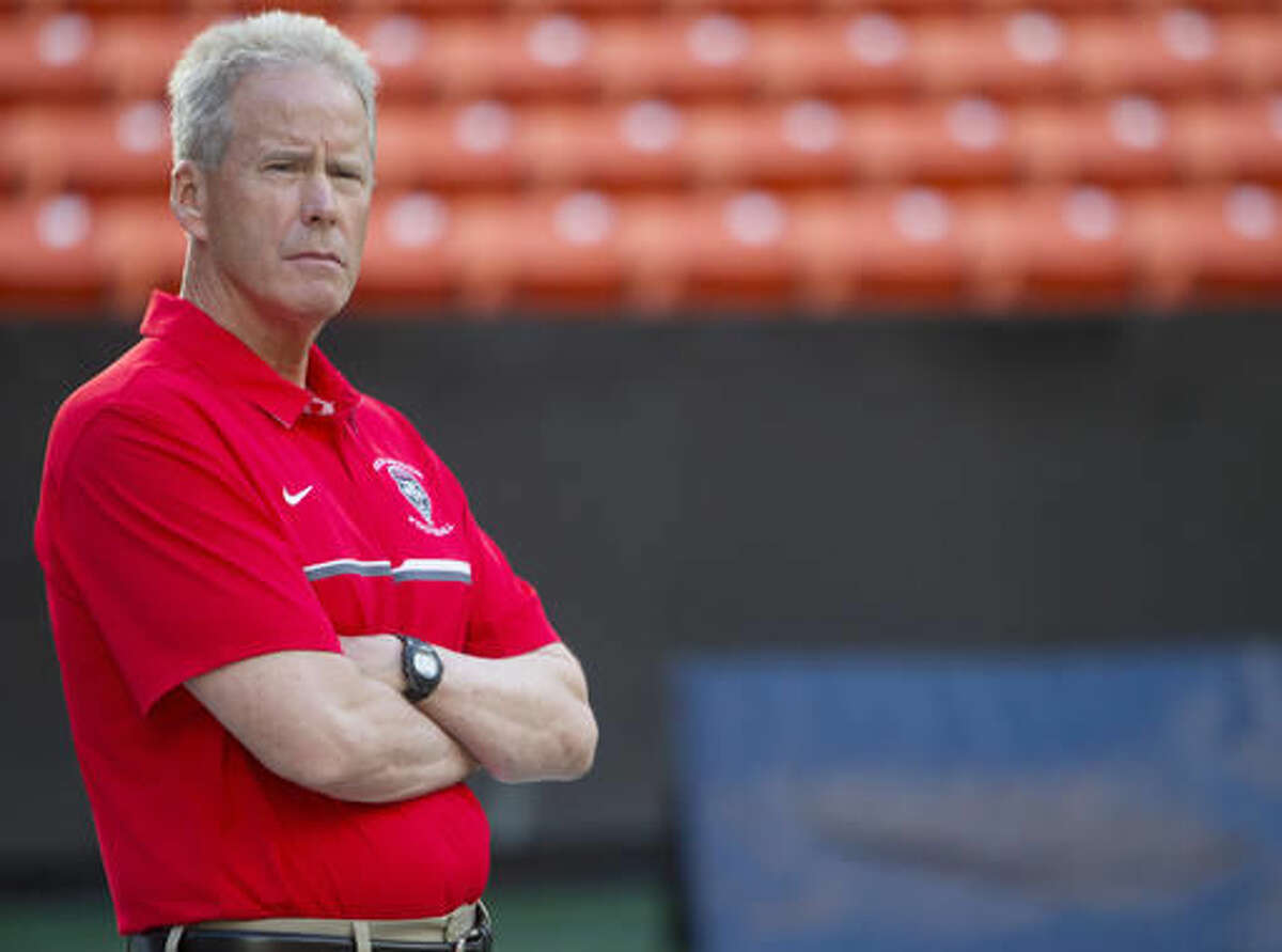 New Mexico coach Bob Davie stands on the field before the team's NCAA college football game against Hawaii, Saturday, Oct. 29, 2016, in Honolulu. (AP Photo/Marco Garcia)