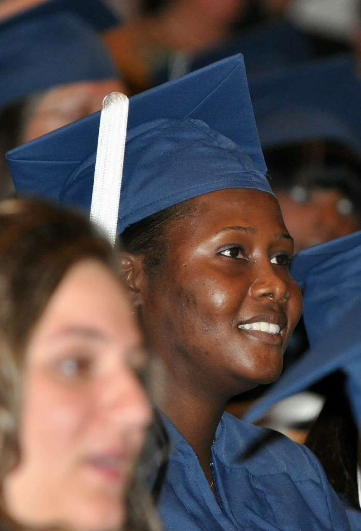 Darline Gaspard, of Stratford, listens during the 2010 St. Vincent's College Commencement Ceremony held at the Regina A. Quick Center at Fairfield University on Friday, May 21, 2010.