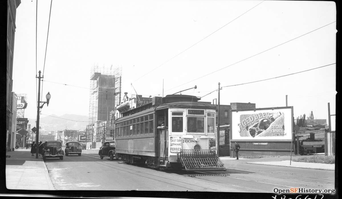 Mission St. near 11th St. 1953, 14-line MSRY 1608, Coca Cola Tower under construction, Hotel Sherman 87 11th Street, looking west on Mission, Twin Peaks in background. Courtesy of OpenSFHistory.org.          
