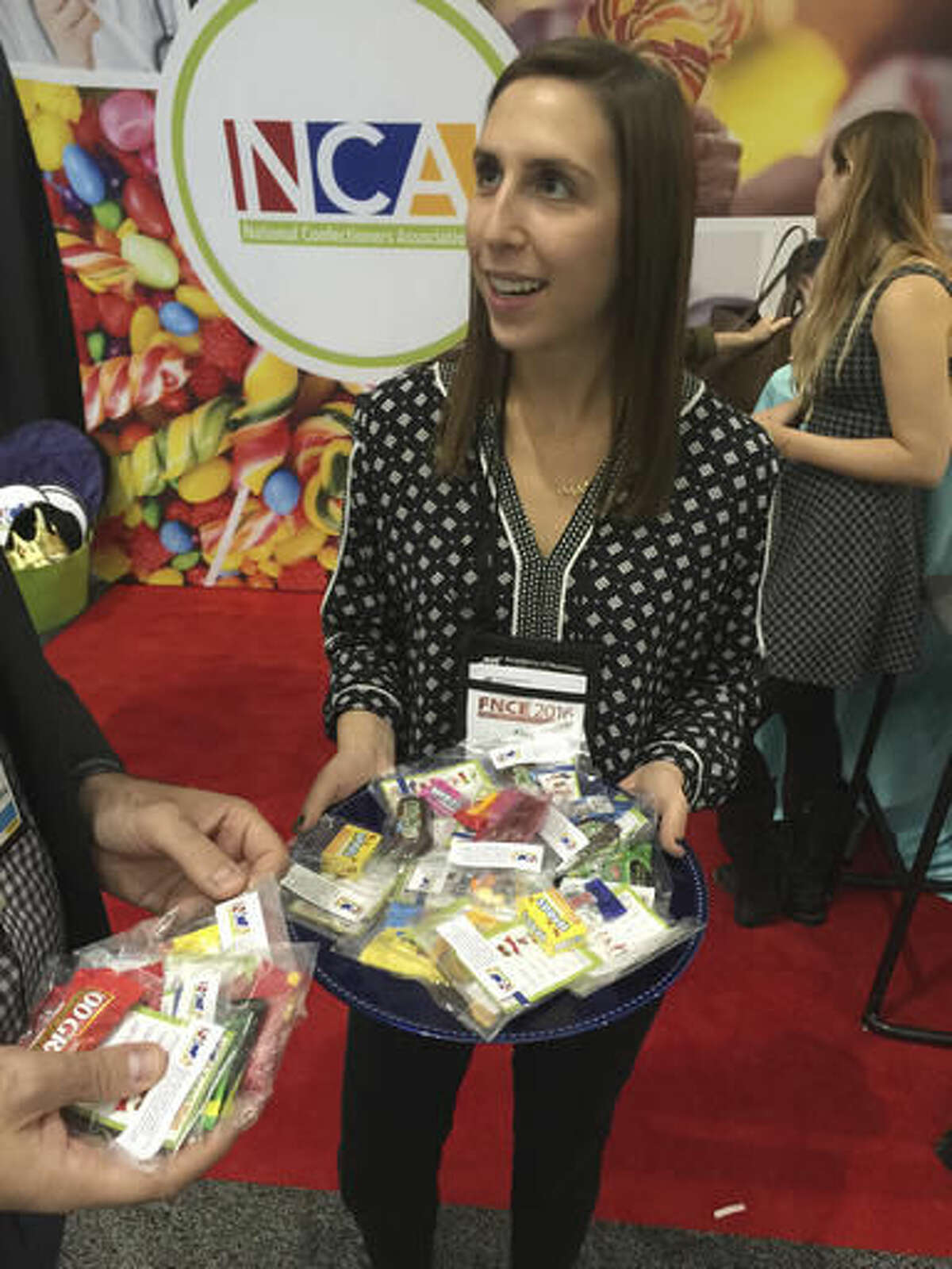 This Oct. 16, 2016, photo shows the National Confectioners Association’s booth at an annual dietitians' conference, where food companies and industry groups explained how their products fit into a healthy diet. The presence of major food companies and industry groups at the conference in Boston underscored the conflict-of-interest issues in the nutrition field. (AP Photo/Candice Choi)