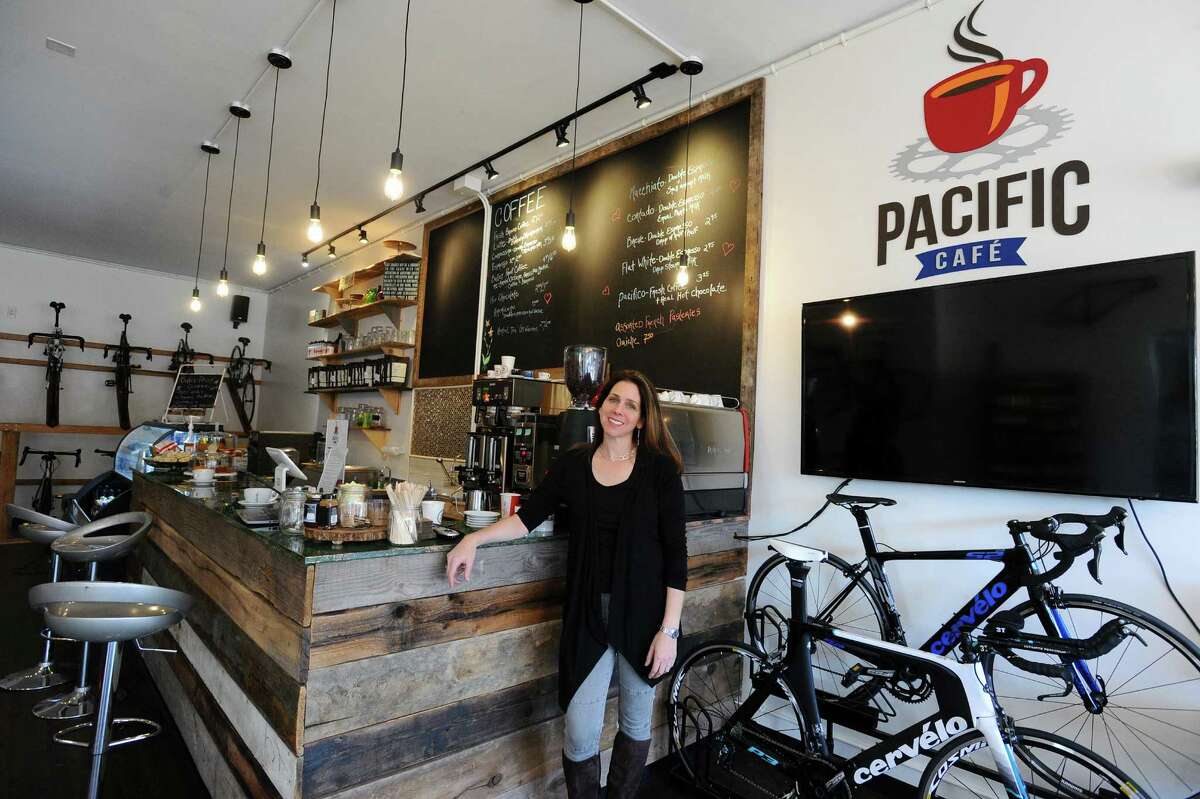 Pacific Cycling President Julie Gabay poses inside the shop's new cafe on High Ridge Rd. in Stamford, Conn. on Thursday, Dec. 1, 2016.