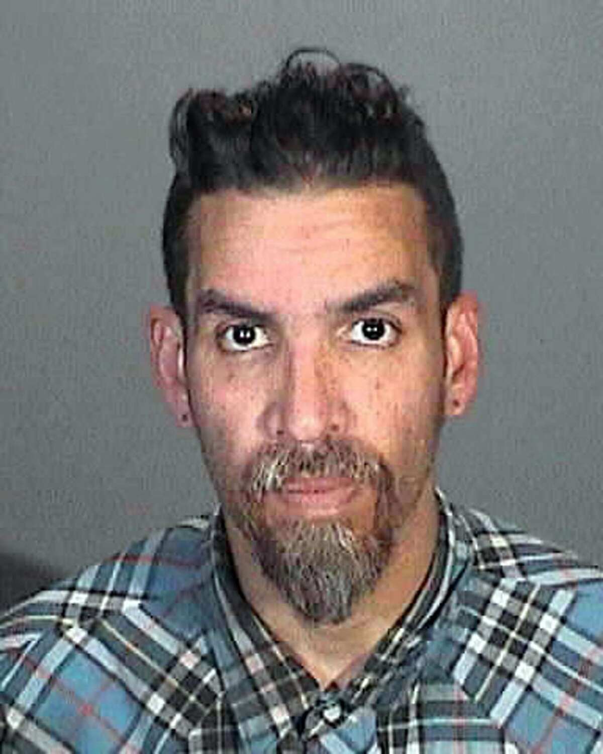 This March 12, 2015 booking photo provided by the Glendale, Calif., Police Department shows Derick Ion Almena. Almena is an operator of the Ghost Ship warehouse in Oakland, in which dozens of people died in a fire that started Dec. 2, 2016. Spokeswoman Tawnee Lightfoot says Almena was stopped for driving with expired registration and, after a consensual search, two license plates from Oakland-area stolen cars were found. The charges apparently were not pursued. (Glendale Police Department via AP)
