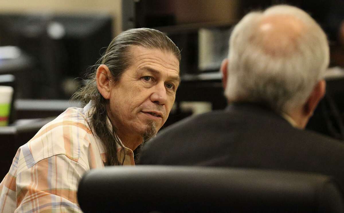 Michael Scott Quinn (left) speaks Monday December 5, 2016 with attorney Robert Shaffer during Quinn's murder trial in the 437th state District Court. Quinn is accused of beating Albert Guerra to death in 2013 and then chopping his legs off and setting his remains on fire.