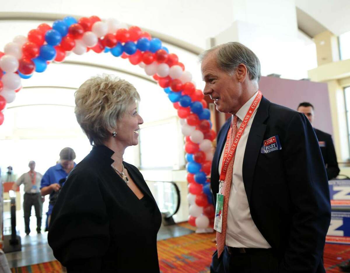 Candidate for US Senate Linda McMahon, left, chats with Connecticut candidate for governor Tom Foley, before the start of the GOP convention in downtown Hartford, Conn. on Friday May 21, 2010.