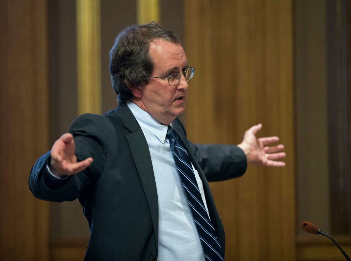 Attorney John Caffry, representing the environmental group Protect the Adirondacks, argues in state Supreme Court on Monday, Dec. 5, 2016, in Albany, N.Y. A state court will decide whether new snowmobile trails being carved through the Adirondack forest violate the 