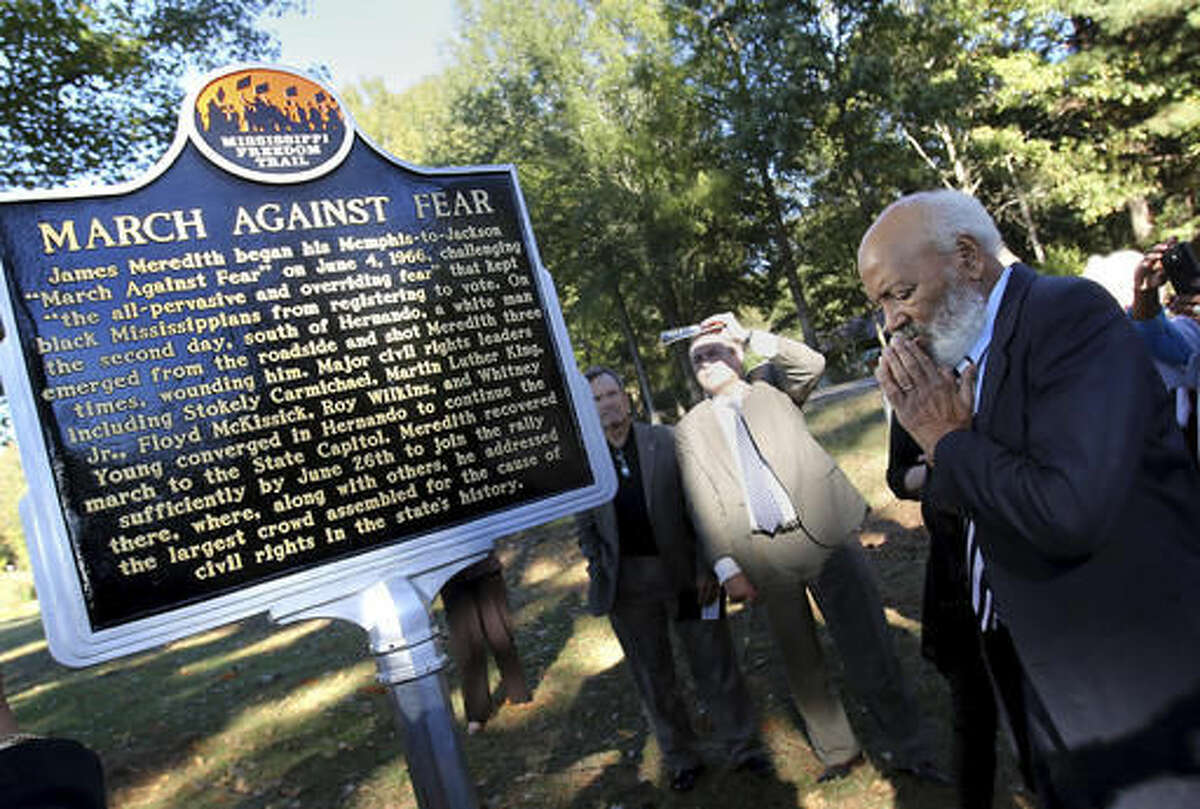 In this Thursday, Nov. 10, 2016 photo, James Meredith pauses for a moment after unveiling a marker in Hernando, Miss., recognizing the spot where he was shot during the "March Against Fear" from Memphis, Tenn., to Jackson, Miss., in 1966. Meredith, 32 at the time, was on the second day of the march when Aubrey James Norvell, an unemployed hardware salesman from Memphis, stepped from a wooded area and peppered him across the chest with three shots from a 16-gauge shotgun. (Stan Carroll/The Commercial Appeal via AP)
