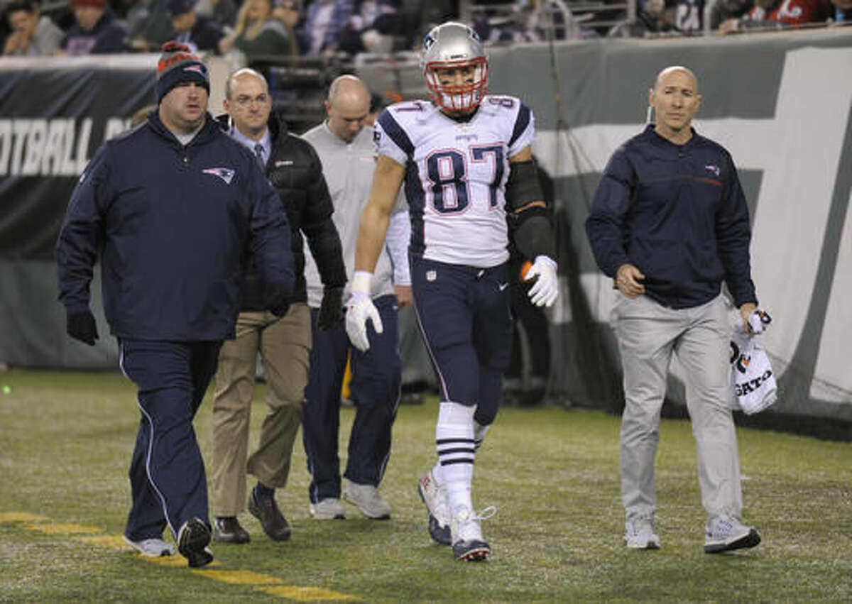 FILE - In this Nov. 27, 2016, file photo, New England Patriots tight end Rob Gronkowski (87) walks off the field with an injury during the second quarter of an NFL football game against the New York Jets,in East Rutherford, N.J. Gronkowski is having surgery for a herniated disk in his back, a person with knowledge of the details tells The Associated Press. The person spoke Thursday, Dec. 1, 2016, on condition of anonymity because the surgery has not yet been announced by the team. The surgery was first reported by the Buffalo News.(AP Photo/Bill Kostroun, File)