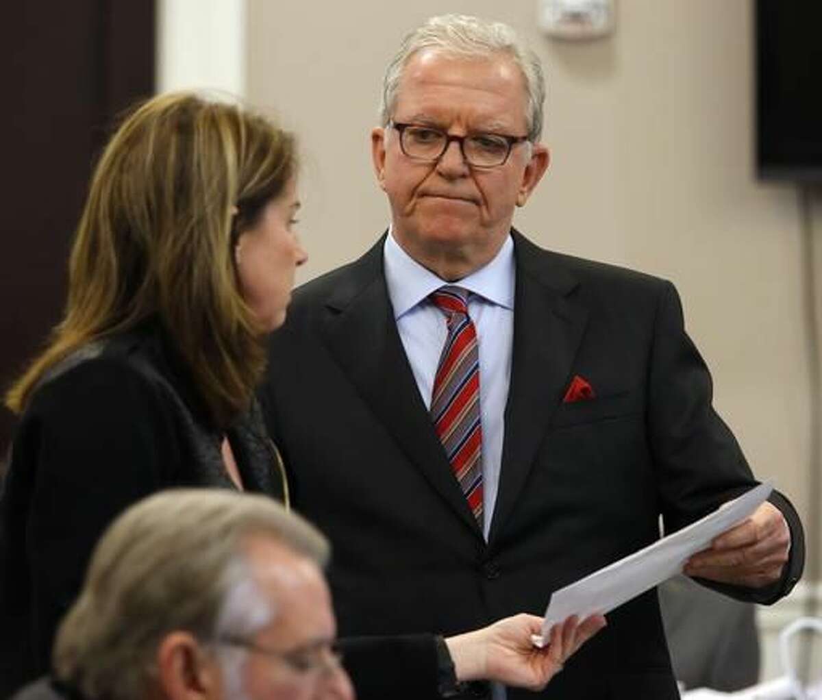 Defense attorney Andy Savage, right, speaks with Ninth Circuit Solicitor Scarlett Wilson in court during the murder trial of former North Charleston police officer Michael Slager at the Charleston County court in Charleston, S.C., Monday, Nov. 28, 2016. A judge is considering whether jurors will visit the spot where a white former South Carolina police officer is accused of shooting and killing an unarmed black man in North Charleston. (Grace Beahm/Post and Courier via AP, Pool)