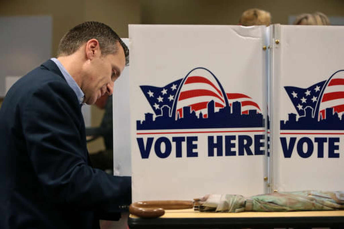 Republican gubernatorial candidate Eric Greitens makes his ballot selections at the St. Louis Public Library Schlafly branch in St. Louis on Tuesday, Nov. 8, 2016. (Cristina M. Fletes/St. Louis Post-Dispatch via AP)