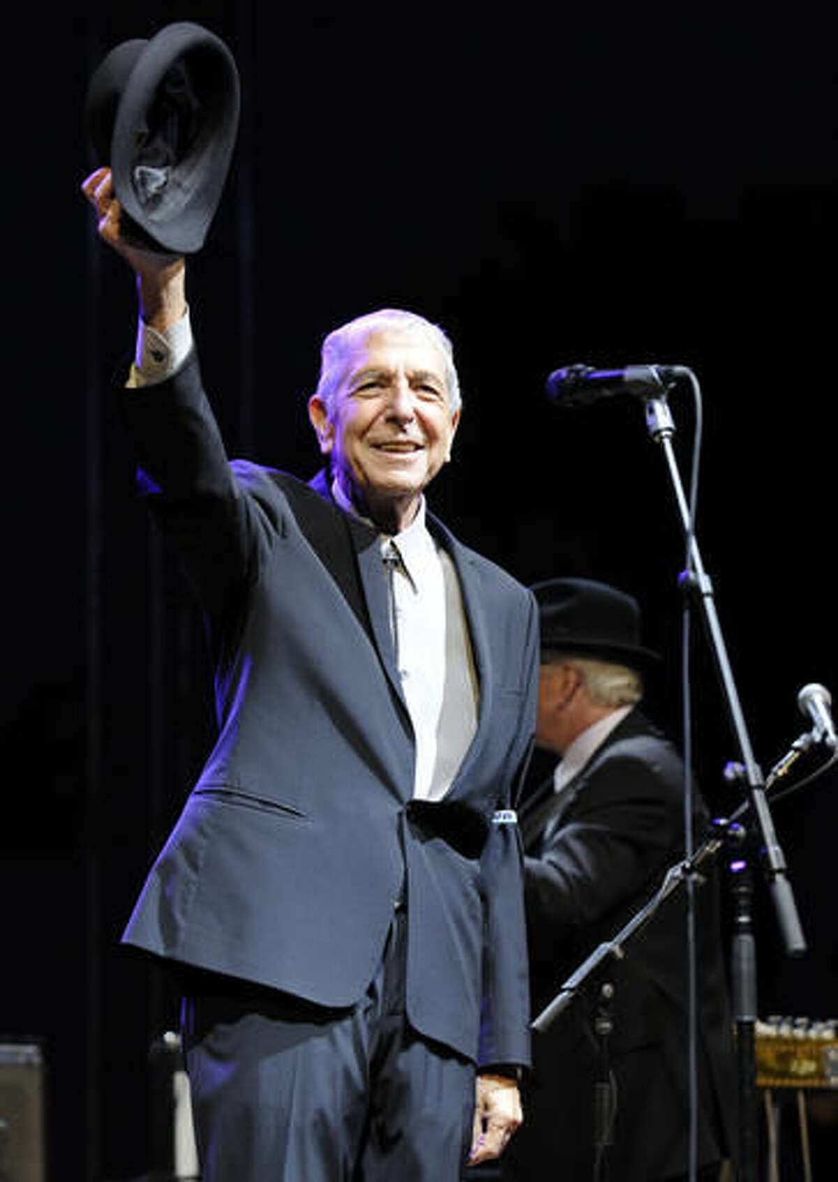 CORRECTS DATE OF STATEMENT - FILE - In this April 17, 2009, file photo, Leonard Cohen salutes the crowd during his performance on the first day of the Coachella Valley Music & Arts Festival in Indio, Calif. Cohen, the gravelly-voiced Canadian singer-songwriter of hits like “Hallelujah,” "Suzanne” and "Bird on a Wire," has died, his management said in a statement Thursday, Nov. 10, 2016. He was 82. (AP Photo/Chris Pizzello)
