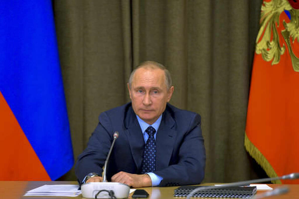 Russian President Vladimir Putin heads a meeting with senior military officials at the Black Sea resort of Sochi, Russia, Wednesday, Nov. 16, 2016. A massive modernization effort has turned nation's military power, that was a crumbling and demoralized structure just a few years ago into a more modern and agile force of 1 million. (Alexei Druzhinin/Sputnik, Kremlin Pool Photo via AP)