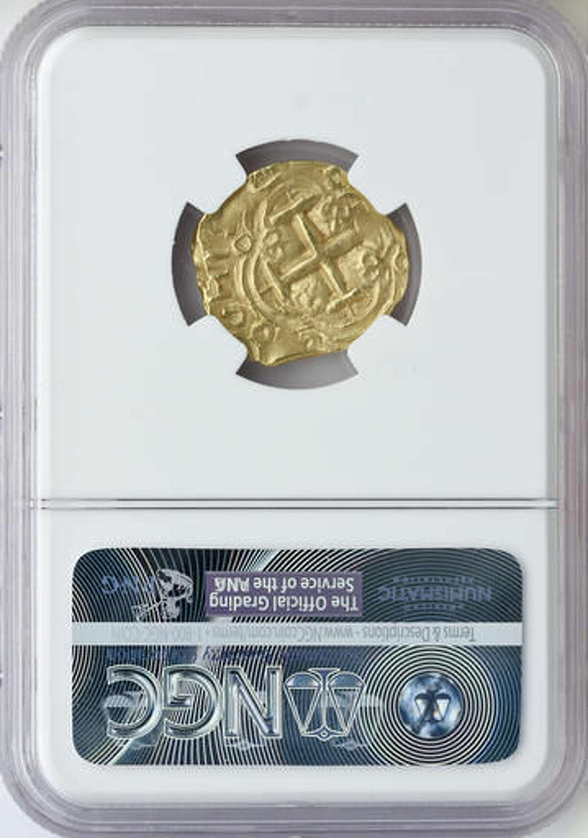 In this Oct. 19, 2016, handout photo photo released by Blanchard and Company, a gold coin from a 300-year-old shipwreck discovered off Florida's coast is displayed in New Orleans. Blanchard and Company is one of two dealers offering the coins from an area where 11 treasure-laden ships of a Spanish fleet were smashed onto reefs by a hurricane on July 31, 1715. The other dealer is California-based Monaco Rare Coins. (Blanchard and Company via AP)