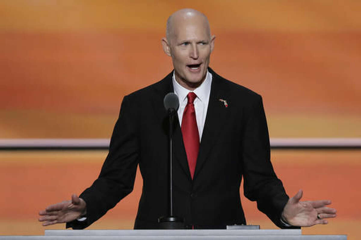 FILE - In this Wednesday, July 20, 2016, file photo, Florida Gov. Rick Scott speaks during the third day of the Republican National Convention in Cleveland. Scott may serve as a model and warning for President-elect Donald Trump. Both opposed the Republican establishment, spoke forcefully on cracking down in immigration and vowed to battle insiders in the capital. But Scott, after taking office, was forced to drop campaign promises, shift his stance on key issues, abandon much of his go-it-alone stance and deal with an ongoing divide with members of his own party. (AP Photo/J. Scott Applewhite, File)