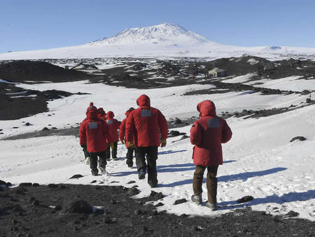 U.S. Secretary of State John Kerry and members of his delegation hike towards the historic Shackleton hut near McMurdo Station, Antarctica on Friday, Nov. 11, 2016. Secretary Kerry is traveling to Antarctica, New Zealand, Oman, United Arab Emirates, Morocco, and will attend APEC in Peru on his 9 day trip. (Mark Ralston/Pool Photo via AP)