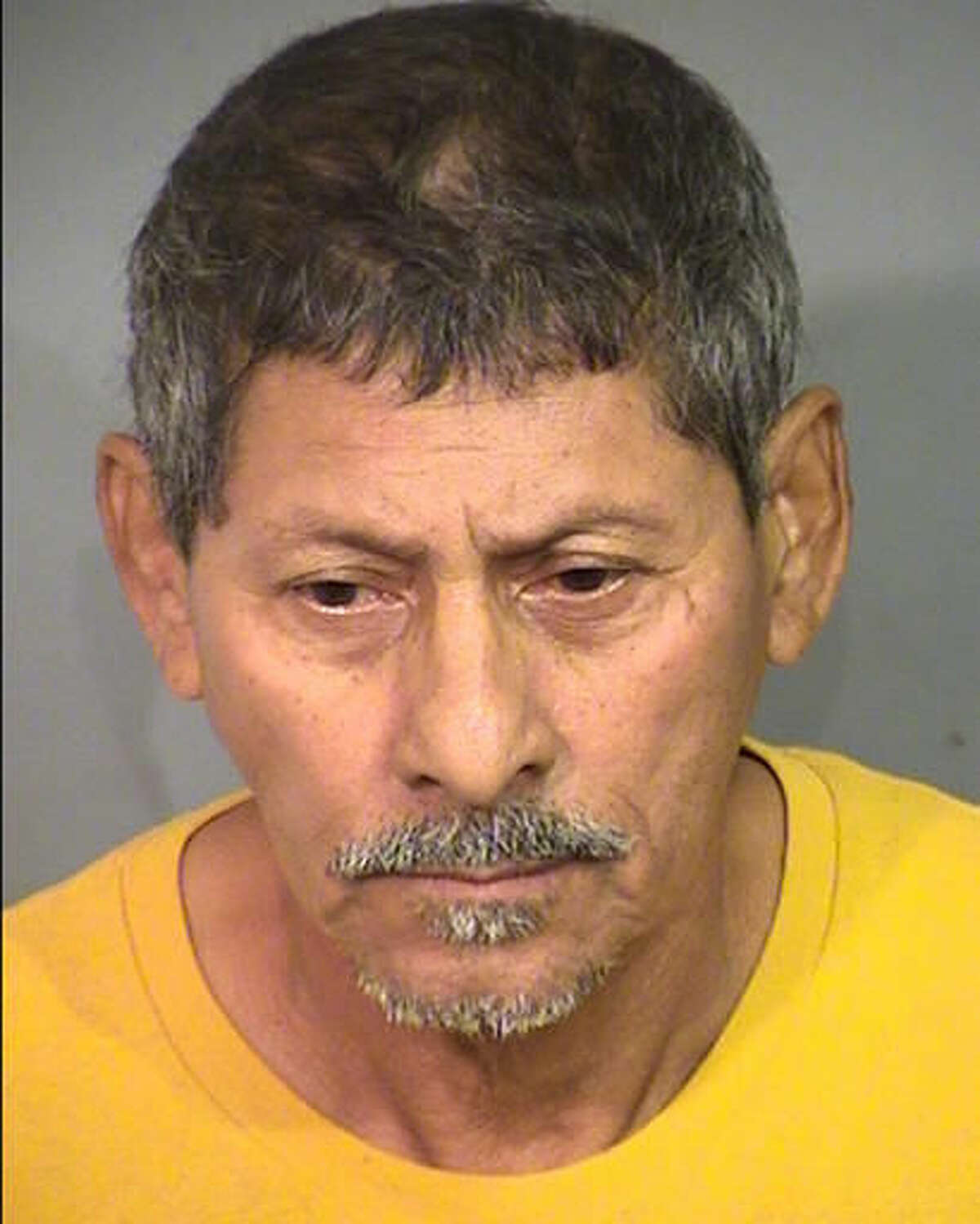 This undated photo provided by the Clark County Detention Center shows Jose Azucena, 63, of Las Vegas, Nev. Police say Azucena was arrested Nov. 12, 2016, in Henderson, Nev., and jailed pending court appearances on child kidnapping, sexual assault and lewdness charges. Azucena is accused of luring neighboring children into his apartment with promises of candy. (Clark County Detention Center via AP)
