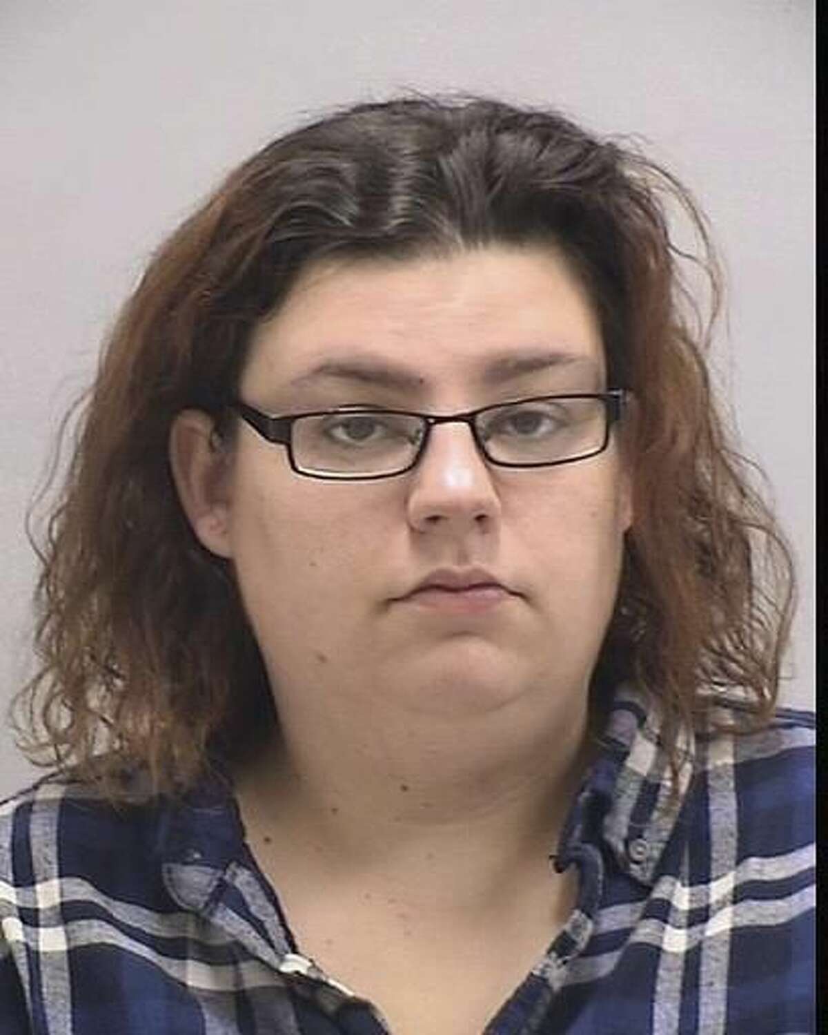 This undated handout photo provided by the Town of Orange Police Department in Connecticut shows Kimberly Onorato. Onorato was charged with a felony count of impairing morals of a minor and misdemeanor breach of peace after police say she engaged in sexual activity in a parked car in on Nov. 15, 2016, while a 6-year-old boy watched in the back seat. (Town of Orange Police Department via AP)