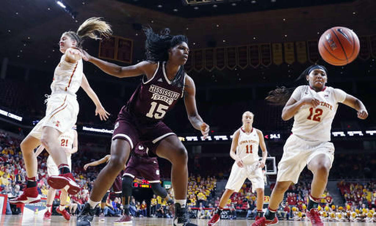 Mississippi State center Teaira McCowan (15) fights for a rebound with Iowa State guard Seanna Johnson (12) during the first half of an NCAA college basketball game, Saturday, Dec. 3, 2016, in Ames, Iowa. (AP Photo/Charlie Neibergall)