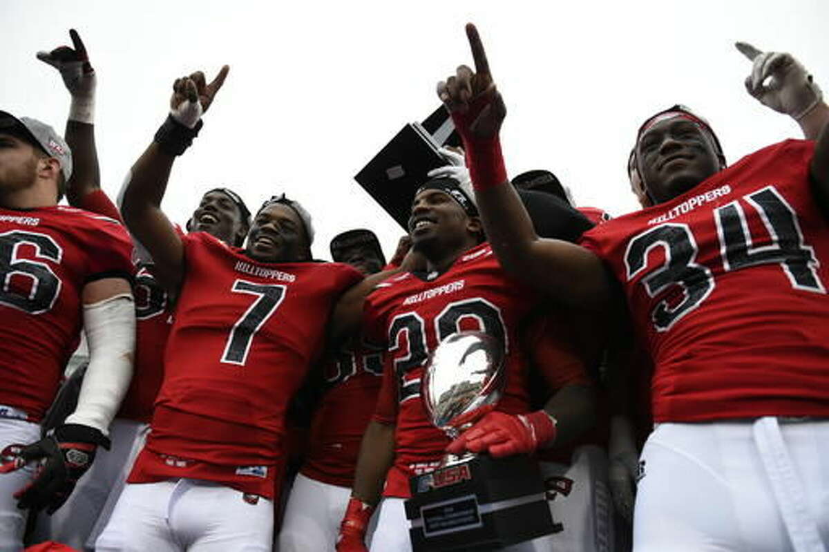 Western Kentucky players cheer after they were presented with Conference USA championship trophy after they defeated Louisiana Tech 58-44 in an NCAA college football game, Saturday, Dec. 3, 2016 at L.T. Smith Stadium in Bowling Green, Ky. (AP Photo/Michael Noble Jr.)