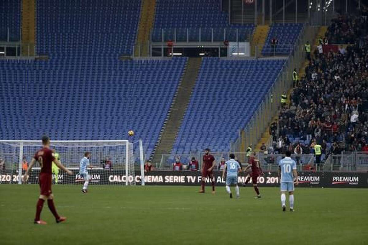 A view of a huge section of empty seats as Roma fans desert derby in protest over security barriers, during a Serie A soccer match between Lazio and Roma, at the Rome Olympic stadium Sunday, Dec. 4, 2016. (AP Photo/Gregorio Borgia)