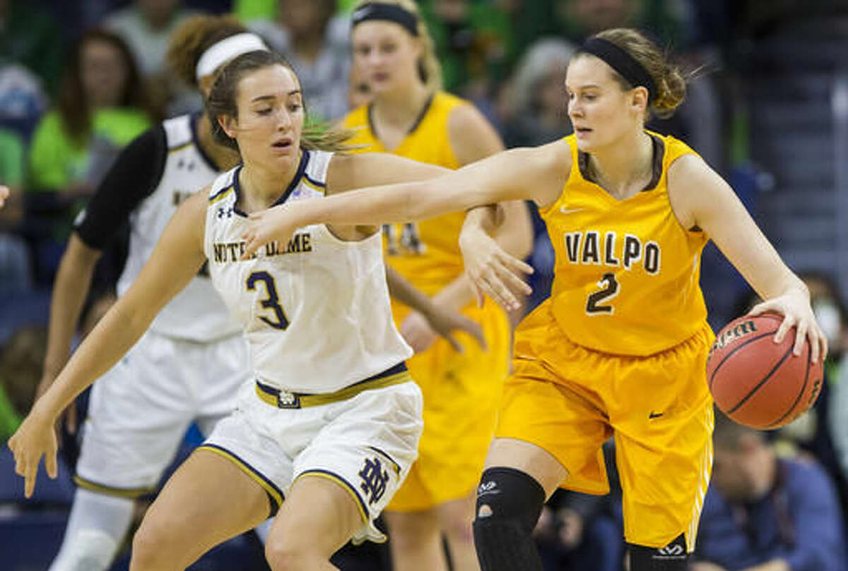 Valparaiso's Meredith Hamlet (2) tries to hold off Notre Dame's Marina Mabrey (3) during the first half of an NCAA college basketball game Sunday, Dec. 4, 2016, in South Bend, Ind. (AP Photo/Robert Franklin)