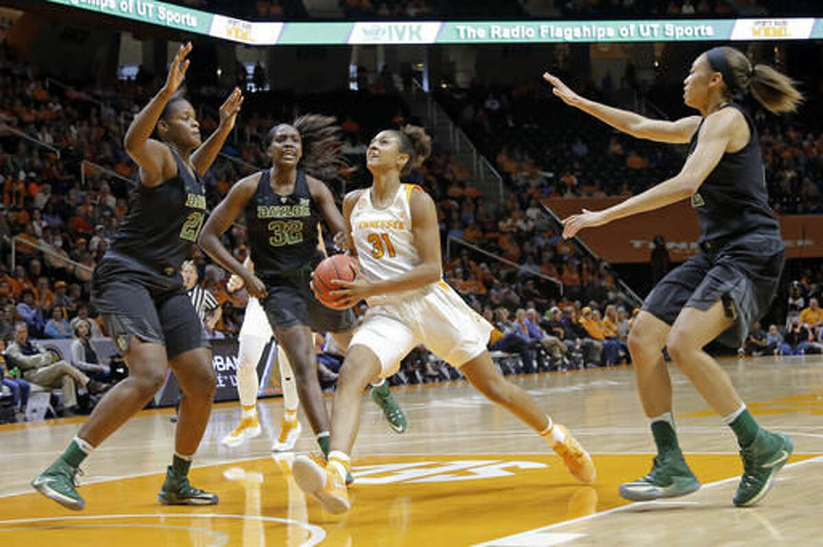 Tennessee's Jaime Nared (31) drives against Baylor's Kalani Brown (21), Beatrice Mompremier (32) and Alexis Prince, right, in the first half of an NCAA college basketball game Sunday, Dec. 4, 2016, in Knoxville, Tenn. (AP Photo/Mark Humphrey)