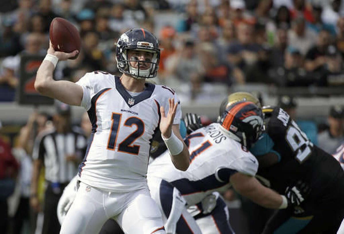 Denver Broncos quarterback Paxton Lynch (12) throws a pass against the Jacksonville Jaguars during the first half of an NFL football game in Jacksonville, Fla., Sunday, Dec. 4, 2016. (AP Photo/John Raoux)