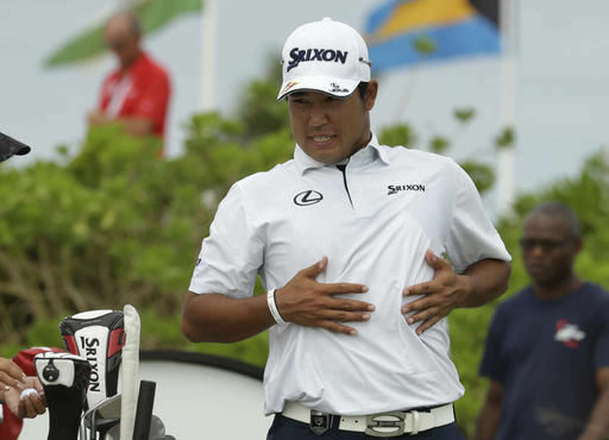 Hideki Matsuyama, of Japan, stretches before teeing off on the first hole during the final round at the Hero World Challenge golf tournament, Sunday, Dec. 4, 2016, in Nassau, Bahamas. (AP Photo/Lynne Sladky)