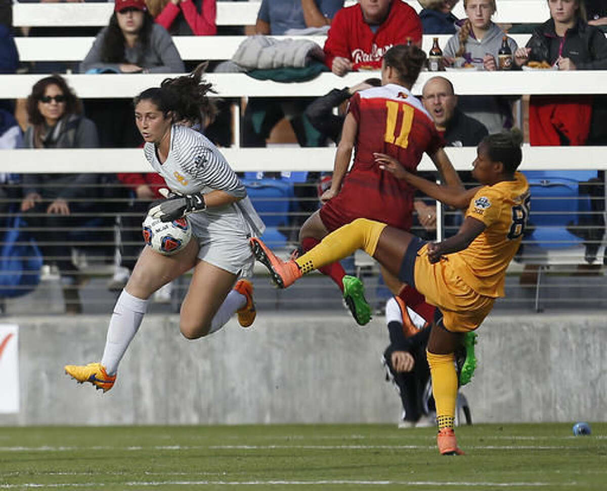 Southern California's goalkeeper Sammy Jo Prudhomme, left, blocks a shot by West Virginia's Kadeisha Buchanan, right, during the first half in the NCAA Women's College Cup soccer final, Sunday, Dec. 4, 2016 in San Jose, Calif. (AP Photo/Tony Avelar)