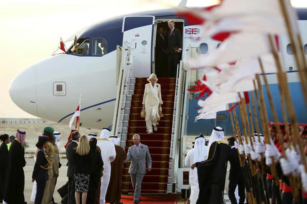 Britain's Prince Charles and his wife Camilla arrive in Manama, Bahrain, on Tuesday, Nov. 8, 2016. The royal couple are on a three-nation tour of the Gulf. (AP Photo/Jon Gambrell)
