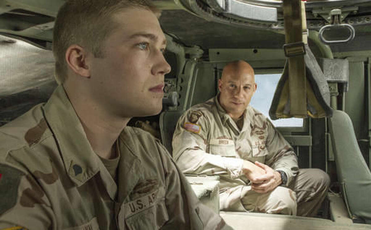 This image released by Sony Pictures shows Joe Alwyn, left, and Vin Diesel in a scene from the film, "Billy Lynn's Long Halftime Walk," in theaters on November 11. (Mary Cybulski/Sony-TriStar Pictures via AP)