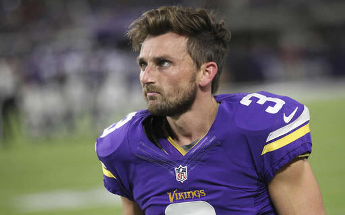 FILE - In this Oct. 3, 2016, file photo, Minnesota Vikings kicker Blair Walsh walks on the sidelines during the first half of an NFL football game against the New York Giants, in Minneapolis. Walsh has not bounced back from the devastating 27-yard miss that kept Minnesota from winning a playoff game last season. For the first time this season, his struggles directly cost the Vikings a victory, with a missed extra point and a blocked field goal in a game that was lost in overtime. (AP Photo/Andy Clayton-King, File)