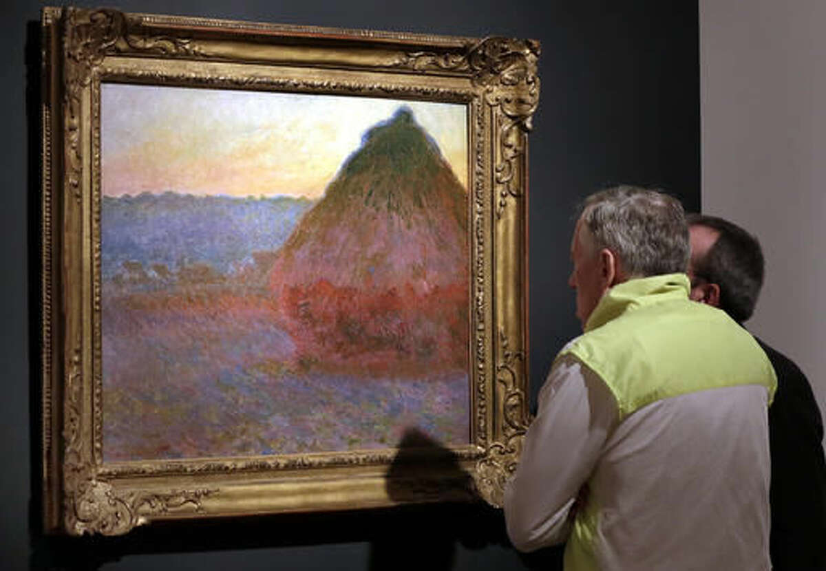 FILE - In this Nov. 4, 2016, file photo, Claude Monet's "Grainstack" is displayed at Christie's, in New York. The 1891 painting being offered Wednesday, Nov. 16, 2016, is one of a few still in private hands. (AP Photo/Richard Drew, File)
