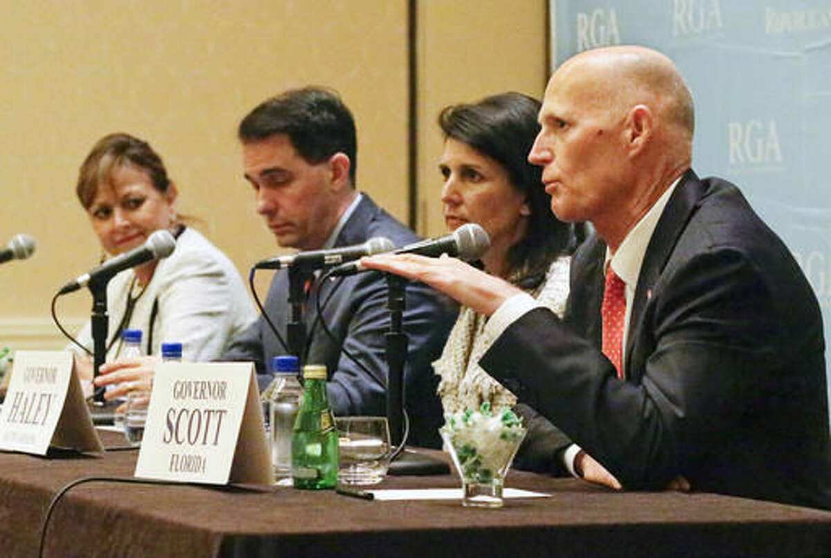 Florida Gov. Rick Scott, front right, speaks during a news conference as from left, New Mexico's Gov. Susana Martinez, Wisconsin's Gov. Scott Walker and South Carolina's Gov. Nikki Haley listen, at the Republican Governors Association annual conference, Tuesday, Nov. 15, 2016, in Orlando, Fla. (AP Photo/John Raoux)