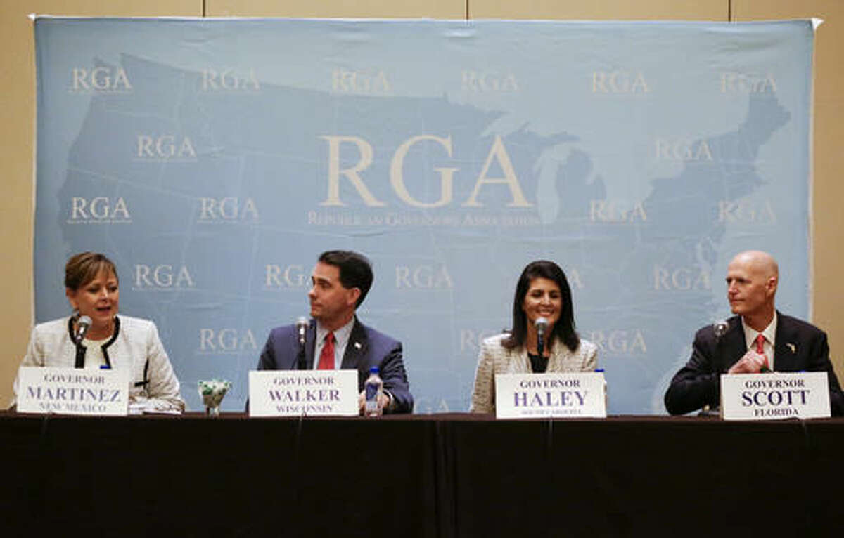 New Mexico Gov. Susana Martinez, left, speaks during a news conference with Wisconsin Gov. Scott Walker, South Carolina Gov. Nikki Haley and Florida Gov. Rick Scott at the Republican Governors Association annual conference, Tuesday, Nov. 15, 2016, in Orlando, Fla. (AP Photo/John Raoux)