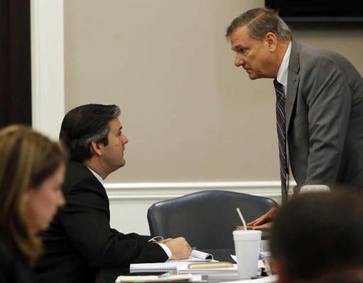 Former North Charleston police officer Michael Slager speaks to a member of the defense team during his trial at the Charleston County court in Charleston, S.C., Monday, Nov. 21, 2016. Slager is charged in the April 2015 shooting death of 50-year-old Walter Scott as Scott fled from a traffic stop.(Grace Beahm/Post and Courier via AP, Pool)