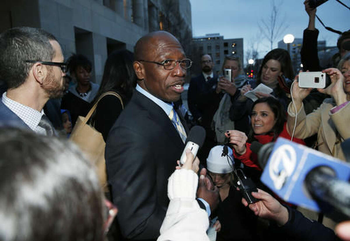 FILE - In this Dec. 22, 2015, file photo, Clarence Moses-EL, center, talks after being released from Denver County jail in Denver. Moses-EL, released from prison last year after spending more than a quarter of a century in prison for a rape he long denied committing, was acquitted of the crime on Monday, Nov. 14, 2016, leaving a courtroom to applause from supporters and chants of "it's over." (AP Photo/David Zalubowski, File)