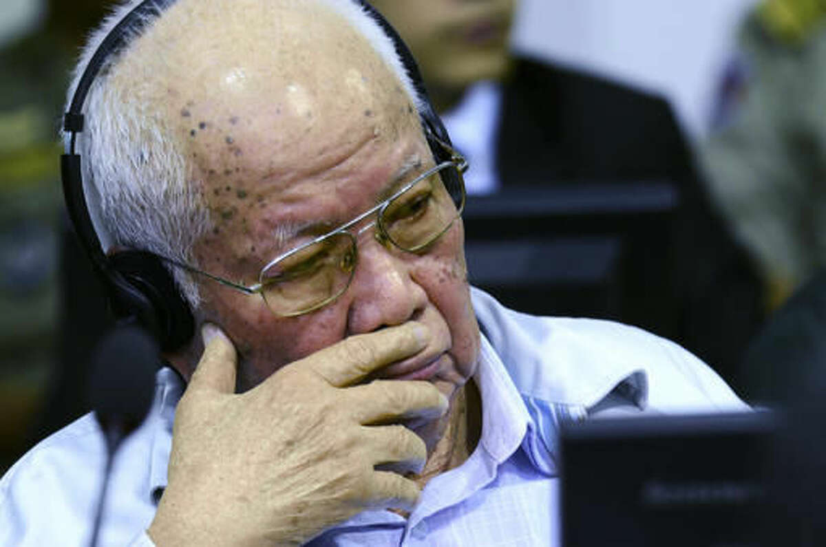 In this photo released by the Extraordinary Chambers in the Courts of Cambodia, former Khmer Rouge senior member Khieu Samphan listens to the verdict which upheld his life sentence and that of colleague Nuon Chea in Cambodia's top court, Phnom Penh, Cambodia, Wednesday, Nov. 23, 2016. The Supreme Court Chamber said the 2014 verdict by a U.N. assisted Khmer Rouge tribunal was "appropriate" given the gravity of the crimes and roles of the two defendants, Samphan, the 85-year-old Khmer Rouge head of state, and Chea, the 90-year-old right-hand man to the communist group's late leader Pol Pot. (Nhet Sok Heng/Extraordinary Chambers in the Courts of Cambodia via AP)