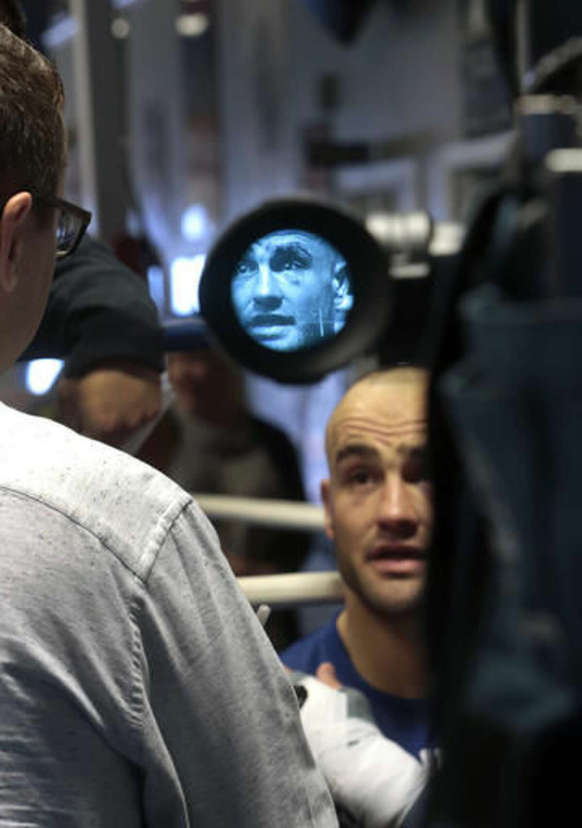 In this Wednesday Nov. 2, 2016 photo, UFC lightweight champion Eddie Alvarez is interviewed following a workout in Philadelphia. Alvarez is scheduled to face featherweight champion Connor McGregor to defend his lightweight belt on Nov. 12 in what will be the first UFC card to be held in New York after the state legislature legalized the sport earlier this year. (AP Photo/Jacqueline Larma)