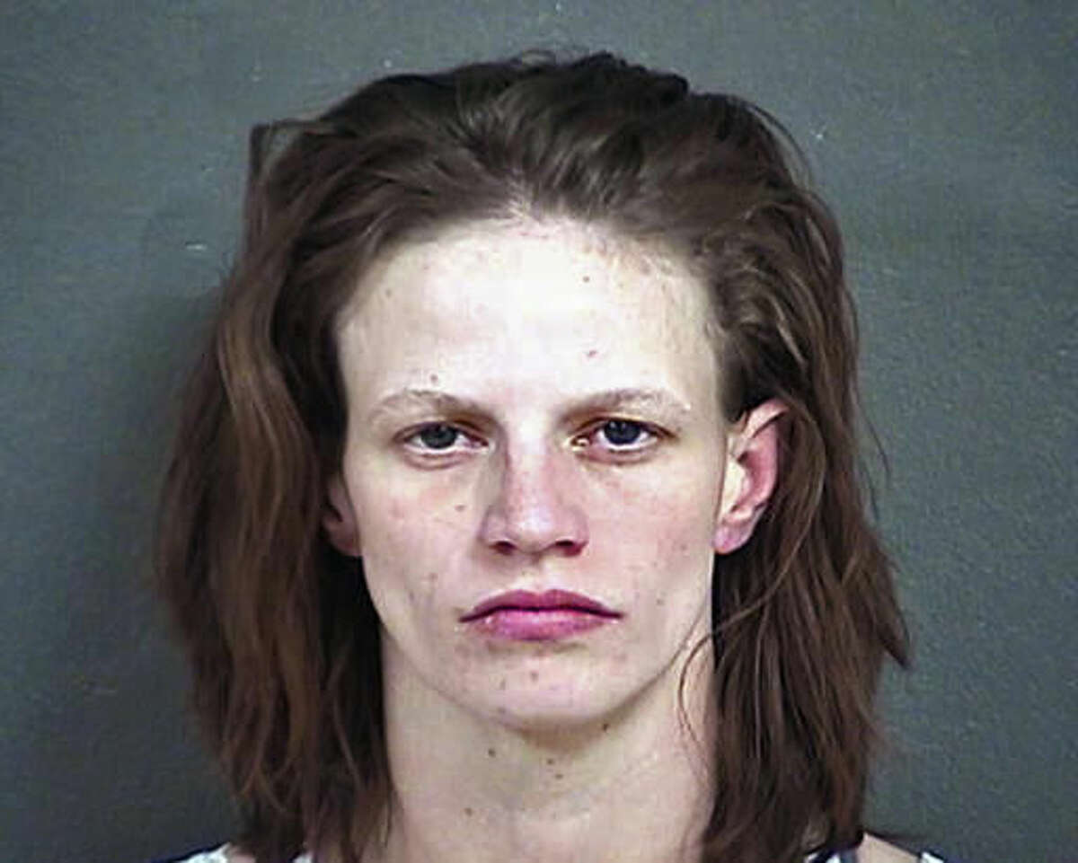 FILE - This undated file photo provided by the Wyandotte County Detention Center in Kansas shows Heather Jones, who was sentenced Monday, Nov. 14, 2016, to life in prison for her role in the death of her 7-year-old stepson, who authorities say had been brutally abused and whose remains were found in the family's home in Kansas City, Kan. (Wyandotte County Detention Center via AP, File)