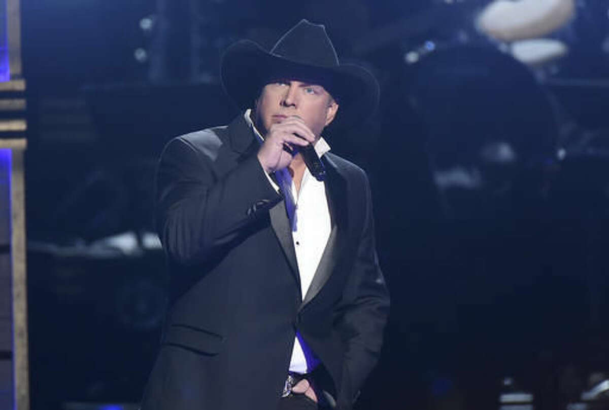FILE - In this Nov. 2, 2016 file photo, Garth Brooks performs at the 50th annual CMA Awards in Nashville, Tenn. NBC said Monday, Nov. 7, that Brooks will be a key adviser on “The Voice” next week, mentoring the show’s top 12 contestants. (Photo by Charles Sykes/Invision/AP, File)