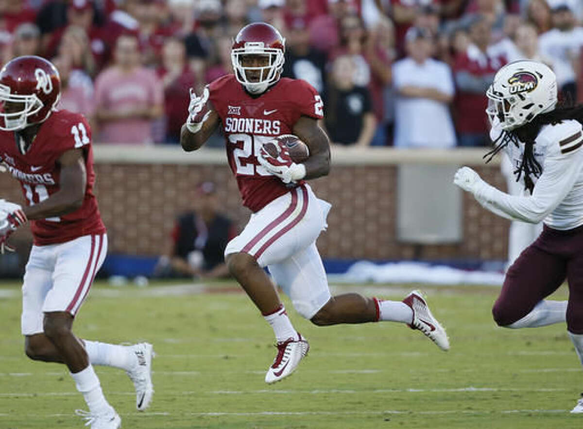 FILE - In this Sept. 10, 2016, file photo, Oklahoma running back Joe Mixon (25) carries during an NCAA college football game against Louisiana Monroe, in Norman, Okla. Mixon will be back Saturday for the Sooners, too. The Big 12’s No. 2 rusher was suspended for last Thursday’s win over Iowa State after having an issue with a parking attendant.(AP Photo/Sue Ogrocki, File)