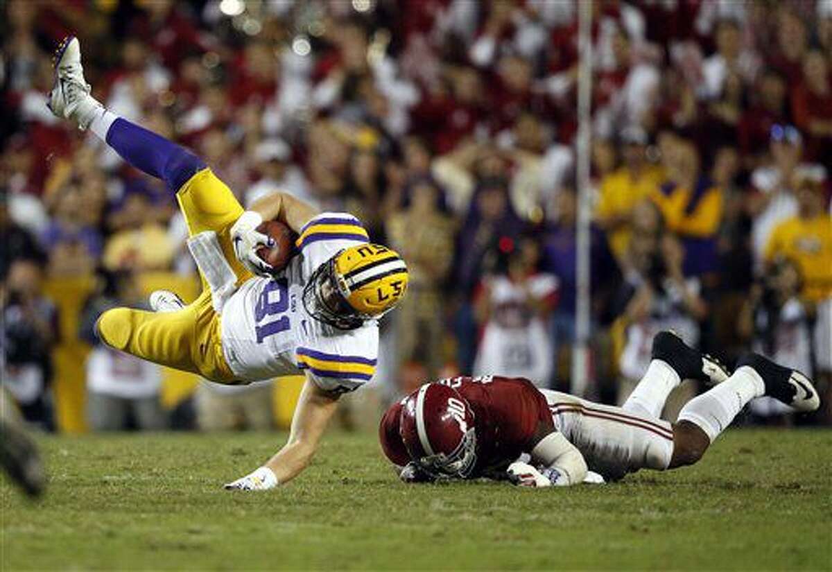 LSU tight end Colin Jeter (81) is upended by Alabama linebacker Reuben Foster (10) on a pass reception in the second half of an NCAA college football game in Baton Rouge, La., Saturday, Nov. 5, 2016. Alabama won 10-0. (AP Photo/Gerald Herbert)
