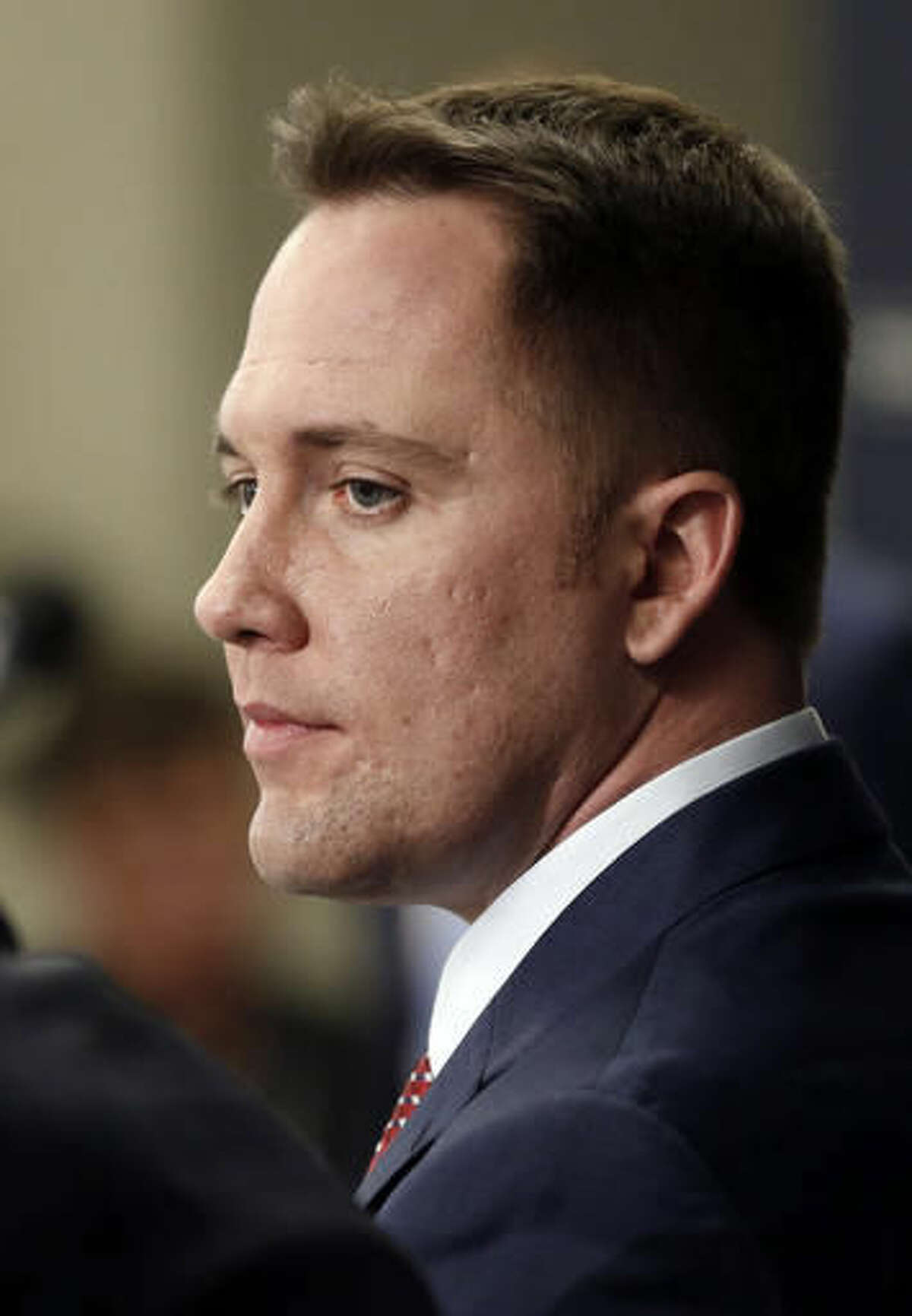 NCORRECTS TAD TO THAD - New Minnesota Twins chief baseball officer Derek Falvey listens during an introductory press conference Monday, Nov. 7, 2016 in Minneapolis. The major league baseball team is looking to Falvey and new general manager Thad Levine with hopes they will lead them out of the abyss after they finished the season in last place. (AP Photo/Jim Mone)