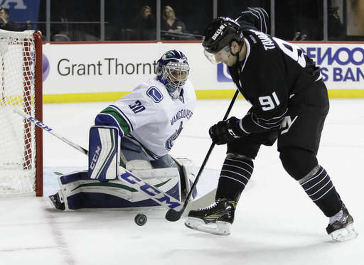Vancouver Canucks goalie Ryan Miller (30) stops a shot on the goal by New York Islanders' John Tavares (91) during the second period of an NHL hockey game Monday, Nov. 7, 2016, in New York. (AP Photo/Frank Franklin II)