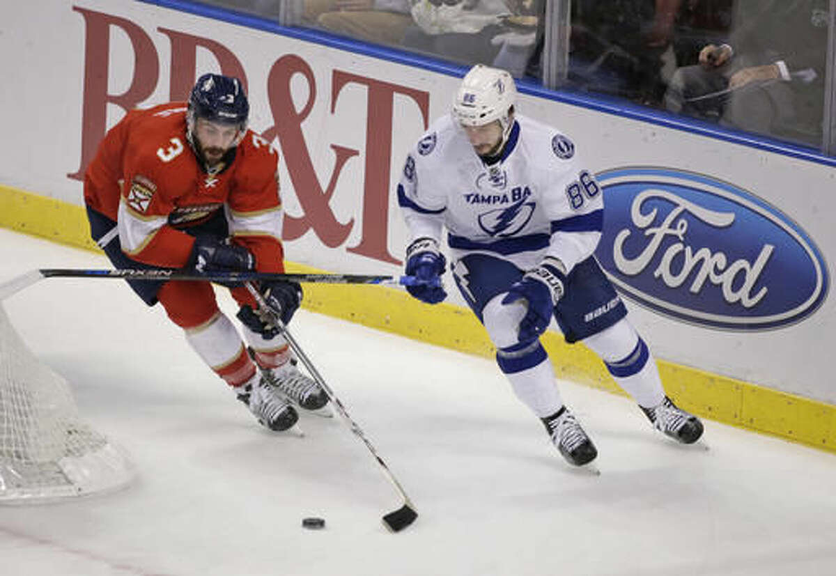 Florida Panthers defenseman Keith Yandle (3) and Tampa Bay Lightning right wing Nikita Kucherov (86) battle for the puck during the first period of an NHL hockey game, Monday, Nov. 7, 2016, in Sunrise, Fla. (AP Photo/Wilfredo Lee)